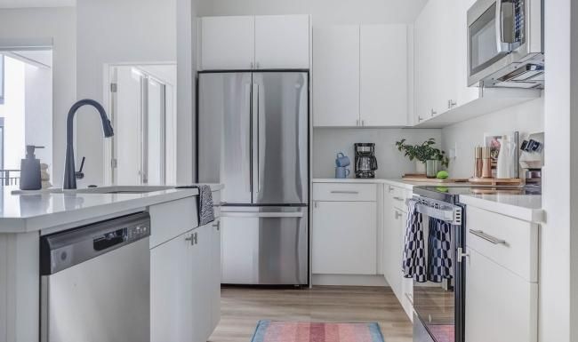 a kitchen with white cabinets