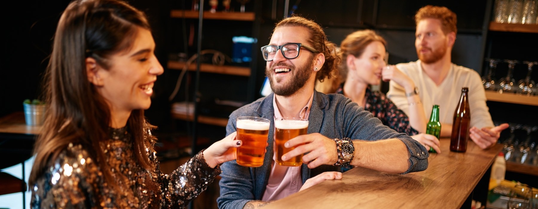 a group of people sitting at a table with drinks