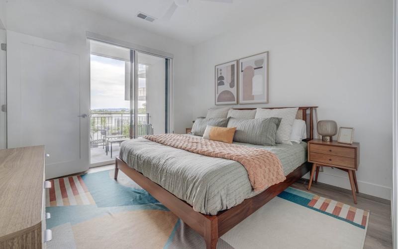 a bedroom with a bed and a table
